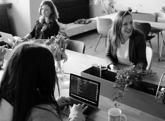 A group of people at work table